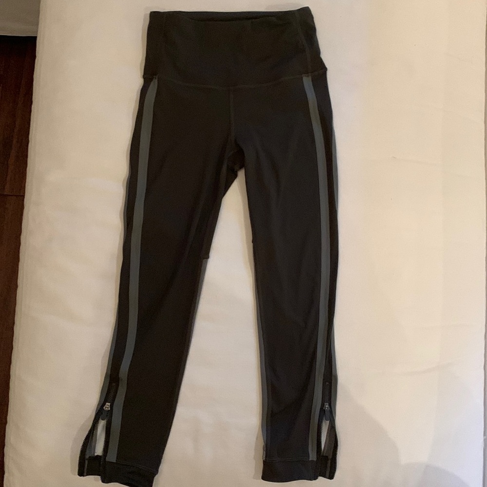 Lululemon  tights- army green- with green stripes /sides. Zipper bottoms